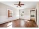 Bright bedroom featuring hardwood floors and a ceiling fan at 608 Magnolia St, New Smyrna Beach, FL 32168