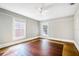 Bright bedroom with hardwood floors and ceiling fan at 608 Magnolia St, New Smyrna Beach, FL 32168