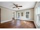 Charming bedroom with hardwood floors and ceiling fan at 608 Magnolia St, New Smyrna Beach, FL 32168