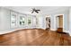 Large living room with hardwood floors and bay windows at 608 Magnolia St, New Smyrna Beach, FL 32168