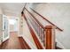 Classic wooden staircase with detailed banister at 608 Magnolia St, New Smyrna Beach, FL 32168