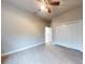 Bedroom with wood-look tile floors and ceiling fan at 720 Stonewood Ct, New Smyrna Beach, FL 32168