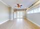 Well-lit bedroom with hardwood floors and French doors at 720 Stonewood Ct, New Smyrna Beach, FL 32168