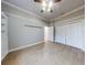 Bedroom with hardwood floors and double doors to closet at 720 Stonewood Ct, New Smyrna Beach, FL 32168