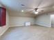 Large bonus room with hardwood floors and a ceiling fan at 720 Stonewood Ct, New Smyrna Beach, FL 32168