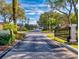 Gated community entrance with paved road at 720 Stonewood Ct, New Smyrna Beach, FL 32168