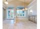 Spacious dining room with tile floors and large windows at 720 Stonewood Ct, New Smyrna Beach, FL 32168