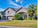 Beautiful two-story home with a three-car garage and landscaped yard at 720 Stonewood Ct, New Smyrna Beach, FL 32168