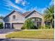 Beautiful two-story home with a three-car garage and landscaped yard at 720 Stonewood Ct, New Smyrna Beach, FL 32168