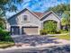 Beautiful two-story home with a three-car garage and landscaped yard at 720 Stonewood Ct, New Smyrna Beach, FL 32168