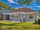 House exterior view showcasing backyard and pergola at 720 Stonewood Ct, New Smyrna Beach, FL 32168