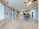 Open kitchen with island and breakfast bar, visible from Gathering room at 720 Stonewood Ct, New Smyrna Beach, FL 32168