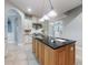 Kitchen island with granite countertop and sink at 720 Stonewood Ct, New Smyrna Beach, FL 32168