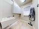 Bright laundry room with white cabinets and a utility sink at 720 Stonewood Ct, New Smyrna Beach, FL 32168