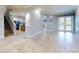 Open living area with tile floors and access to backyard at 720 Stonewood Ct, New Smyrna Beach, FL 32168