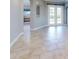 Open living area with tile floors and access to backyard at 720 Stonewood Ct, New Smyrna Beach, FL 32168