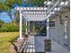 Backyard patio with pergola and screened enclosure at 720 Stonewood Ct, New Smyrna Beach, FL 32168