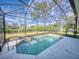 Refreshing screened pool, perfect for relaxation at 720 Stonewood Ct, New Smyrna Beach, FL 32168