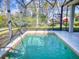 Enjoy this refreshing screened pool and backyard at 720 Stonewood Ct, New Smyrna Beach, FL 32168