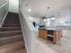 Carpeted staircase leading to the upper level of the home at 720 Stonewood Ct, New Smyrna Beach, FL 32168