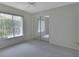 Bright bedroom with mirrored closet doors and neutral walls at 809 E 7Th Ave, New Smyrna Beach, FL 32169