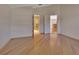 Bedroom with hardwood floors and access to bathroom and kitchen at 809 E 7Th Ave, New Smyrna Beach, FL 32169