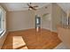 Bright living room with hardwood floors and high ceilings at 809 E 7Th Ave, New Smyrna Beach, FL 32169