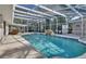 Inviting screened pool area with spa and lanai at 809 E 7Th Ave, New Smyrna Beach, FL 32169