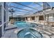 Enclosed pool and spa with a covered patio at 809 E 7Th Ave, New Smyrna Beach, FL 32169