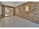 Bright sunroom with brick walls and tile floors at 809 E 7Th Ave, New Smyrna Beach, FL 32169