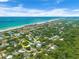 Aerial view showing home's location near the beach at 81 Alberta Ave, Ponce Inlet, FL 32127