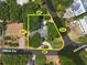 Aerial view of a single-Gathering home with a large lot and mature trees at 81 Alberta Ave, Ponce Inlet, FL 32127