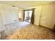 Bedroom with patio doors leading to an outdoor seating area at 81 Alberta Ave, Ponce Inlet, FL 32127