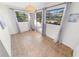 Light-filled dining area featuring tile floors and window views at 81 Alberta Ave, Ponce Inlet, FL 32127