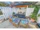 Relaxing patio area with wooden seating and pergola at 81 Alberta Ave, Ponce Inlet, FL 32127