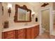 Bathroom boasts a double vanity, ornate mirror, and access to a toilet area at 817 Hail Ct, Port Orange, FL 32127