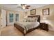 King-size bedroom with French doors leading to the outdoors at 817 Hail Ct, Port Orange, FL 32127