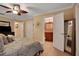 Spacious bedroom with ensuite bathroom and ceiling fan at 817 Hail Ct, Port Orange, FL 32127