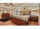 Bright bedroom with king-size bed and hardwood floors at 817 Hail Ct, Port Orange, FL 32127