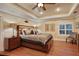 Luxurious main bedroom with a king-size bed and hardwood floors at 817 Hail Ct, Port Orange, FL 32127