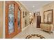 Bright entryway with decorative furniture and tiled floors at 817 Hail Ct, Port Orange, FL 32127