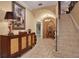 Elegant entryway with tile flooring, stone accents, and a grand staircase at 817 Hail Ct, Port Orange, FL 32127