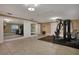 Home gym with mirrored walls and exercise machine at 817 Hail Ct, Port Orange, FL 32127