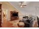 Spacious loft area with a comfortable seating arrangement and hardwood floors at 817 Hail Ct, Port Orange, FL 32127