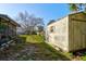 Backyard with shed and mature tree at 84 Tumbler Dr, Port Orange, FL 32129