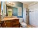 Bathroom with wood vanity and tiled shower at 84 Tumbler Dr, Port Orange, FL 32129