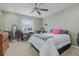 Bedroom with a queen bed, vanity, and ceiling fan at 980 Canal View Blvd # C7, Port Orange, FL 32129