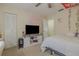 Bedroom with a TV, dresser, and a queen bed at 980 Canal View Blvd # C7, Port Orange, FL 32129