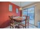 Bright dining area with table and chairs, and access to a patio at 980 Canal View Blvd # C7, Port Orange, FL 32129