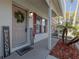 Inviting front entrance with a wreath, charming welcome mat and home sweet home sign at 980 Canal View Blvd # C7, Port Orange, FL 32129